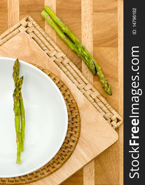 Fresh asparagus on eco wooden background