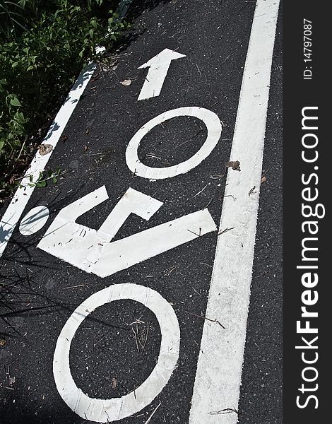 Bicycle road sign painted on the asphalt. Bicycle road sign painted on the asphalt