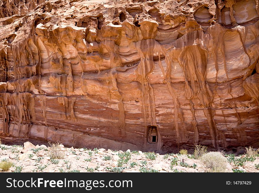 Small door in a big rock near the Monastery. Petra, Jordan