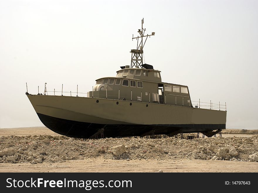 A out of service war ship lifted onto dry land for decorative purposes