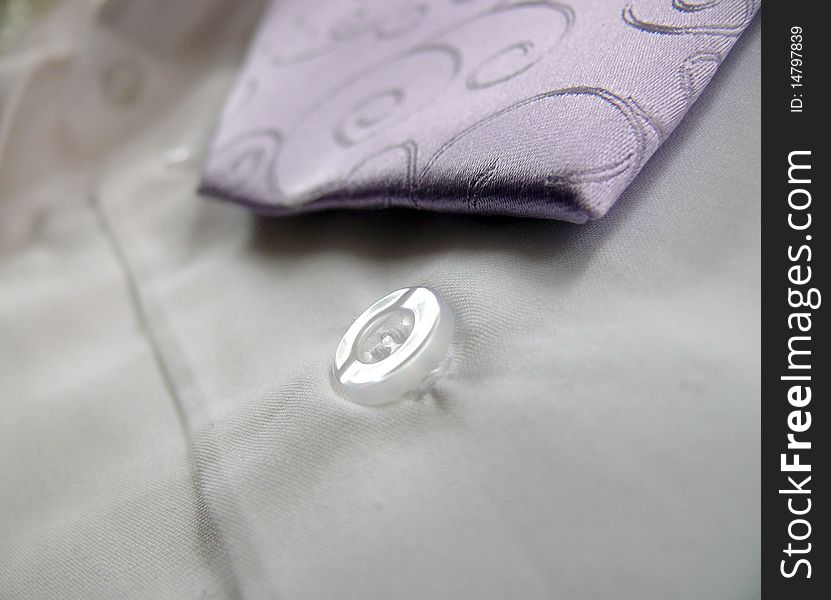 Detail of Lila ornaments tie with white shirt
