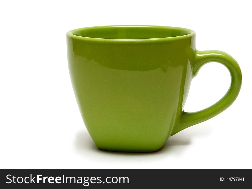 A cup of green on a white background, isolated.