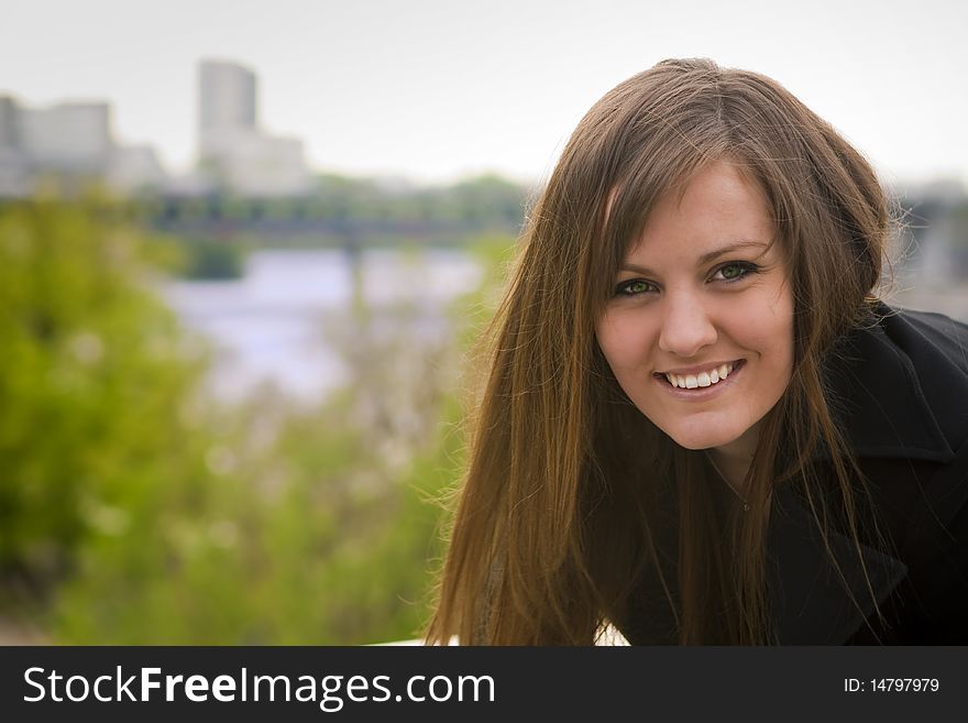 Portrait of nice girl on the background of the city