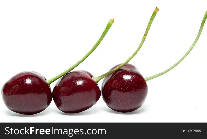Three cherries are in a row. It is isolated. Three cherries are in a row. It is isolated