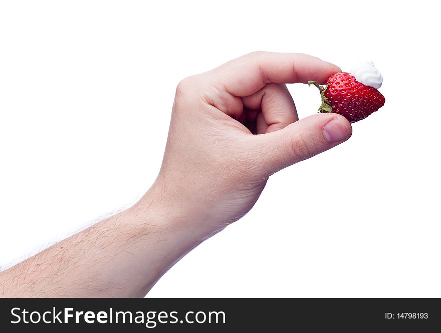 Strawberry with cream in hand isolated on white