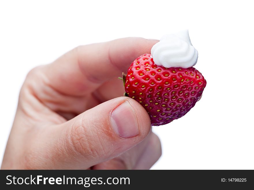 Strawberry with cream in hand isolated on white