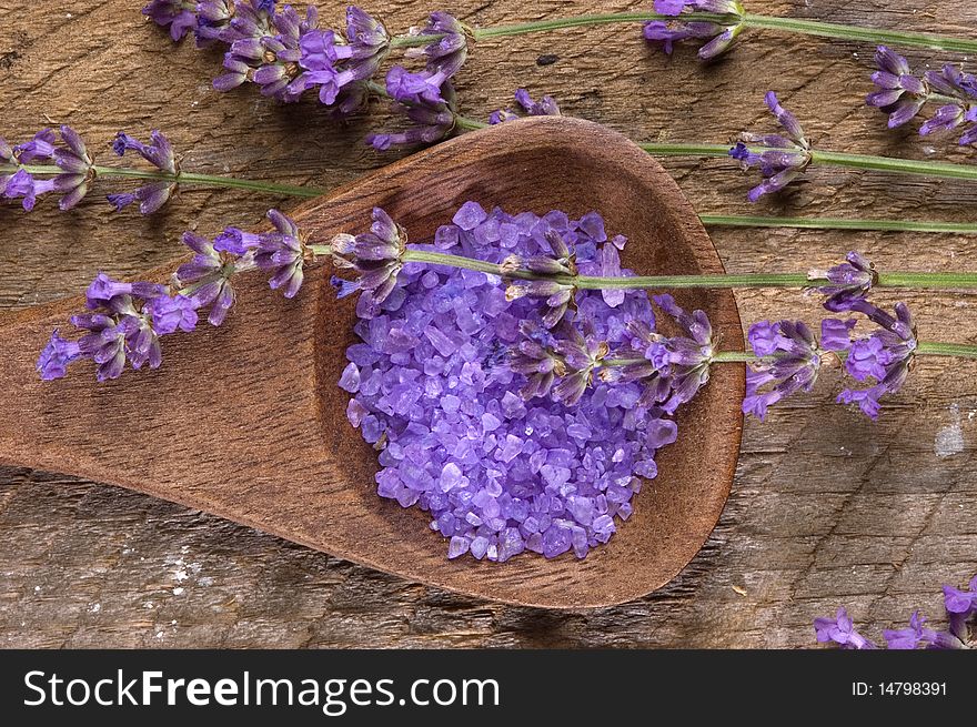 Sea Salt With Herbs In A Wooden Spoon