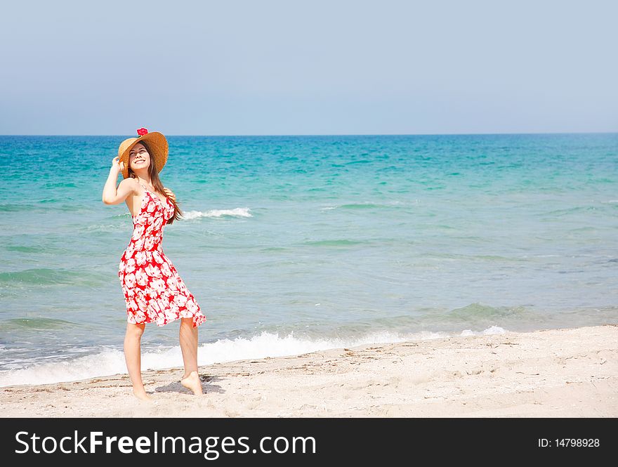 Young happy girl on beach