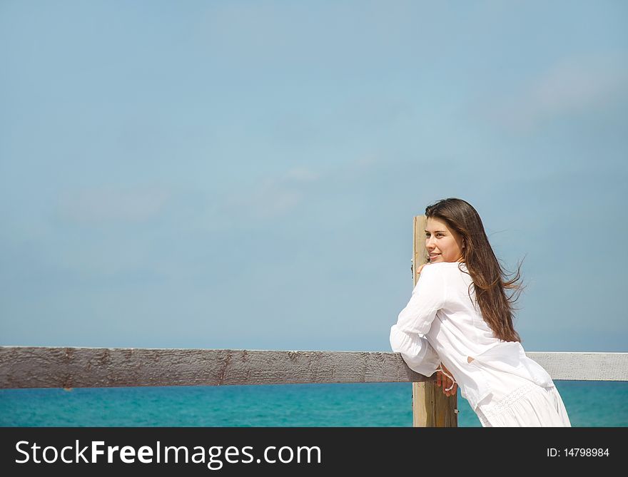 Young romantic girl on sea background