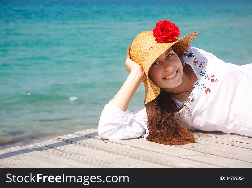 Young happy girl on sea background