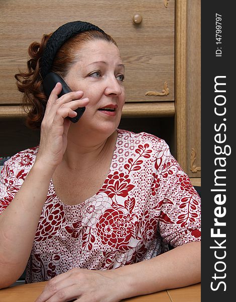 Old woman calling by phone