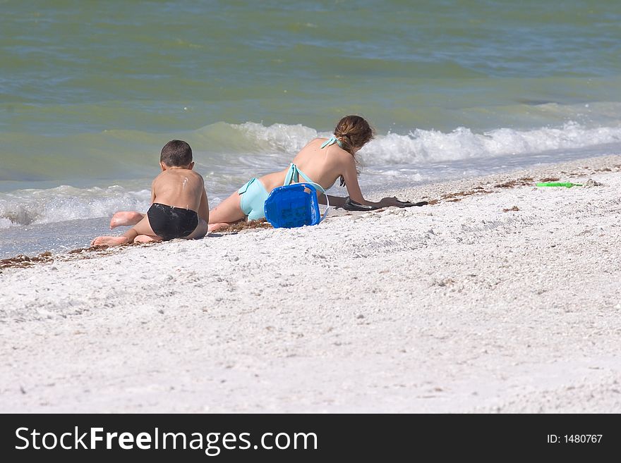 Boy and Girl Playing on the Beach