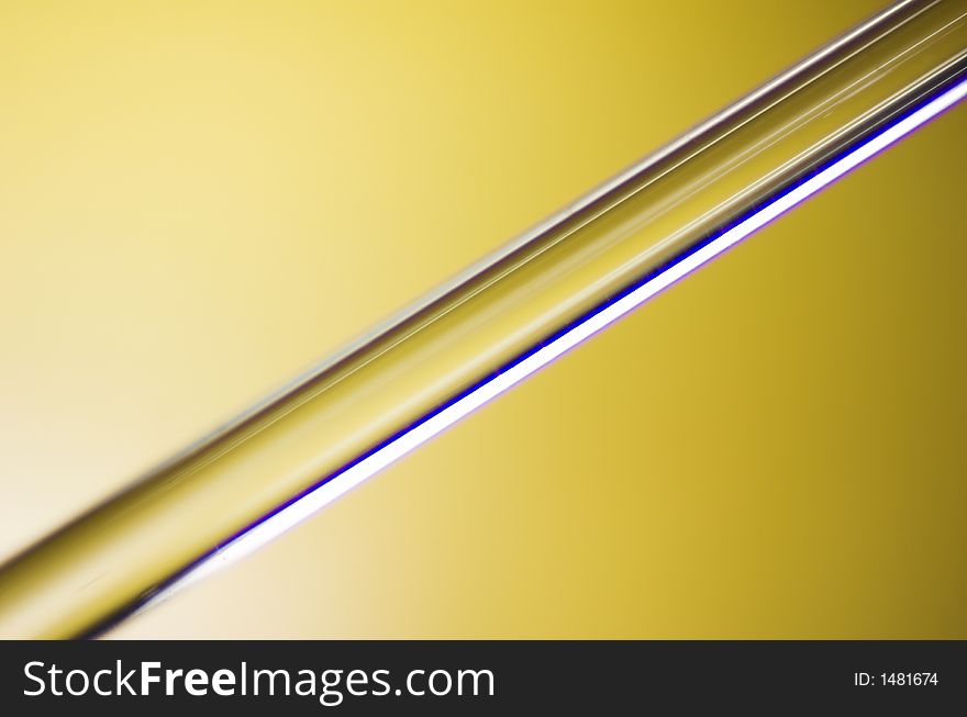 Glass thin tube on green background. Glass thin tube on green background