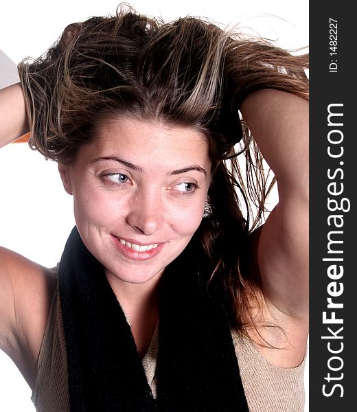 Smiling happy attractive woman holding her hair up. Smiling happy attractive woman holding her hair up