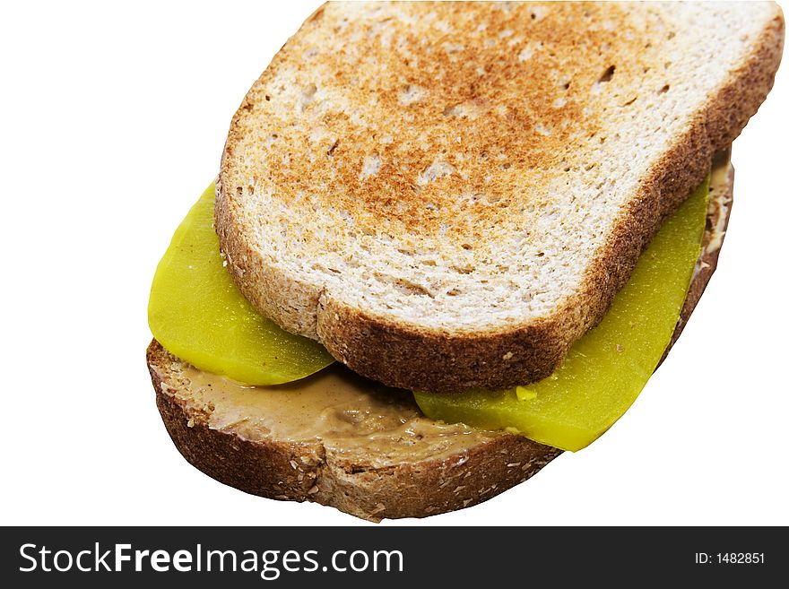 Peanut butter and dill pickle sandwich on wheat bread toasted to a golden brown. Peanut butter and dill pickle sandwich on wheat bread toasted to a golden brown