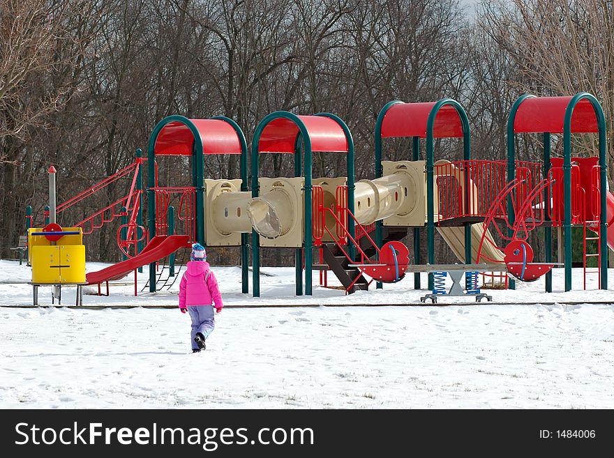 Girl And Playground At Winter