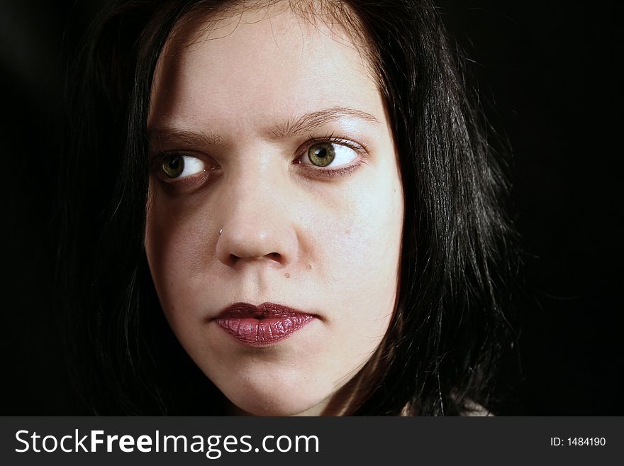 Young woman portrait, close up on black background. Young woman portrait, close up on black background