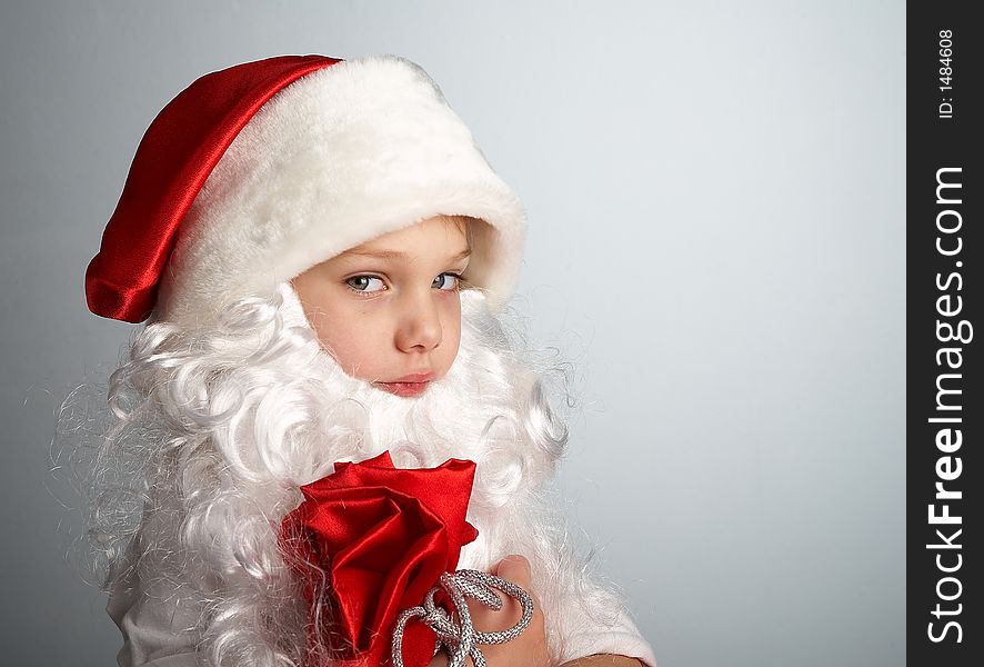 Small boy with santa's hat and bag full of gifts. Small boy with santa's hat and bag full of gifts