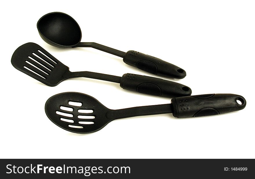 Three diferents plasic spoons for cook