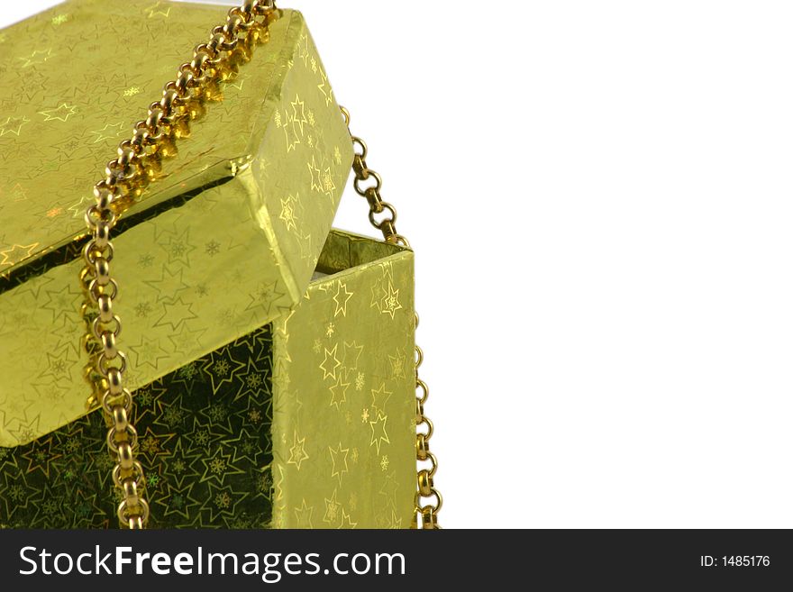 Gold chain over gift box isolated