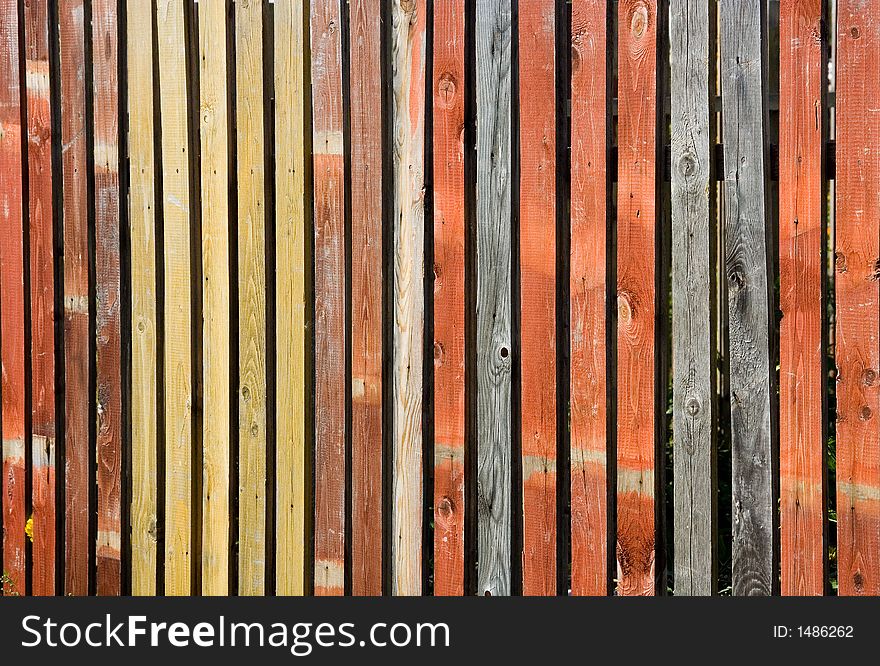 A photo of a color wooden fence