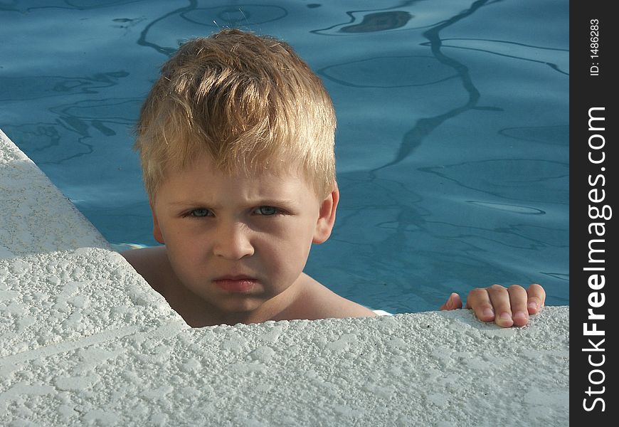 Young boy in the swimming pool