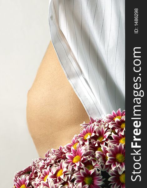 Image of woman belly and flowers. Image of woman belly and flowers
