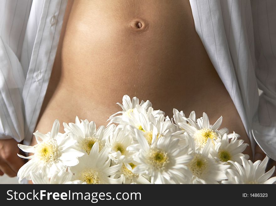 Woman's belly and white flowers. Woman's belly and white flowers
