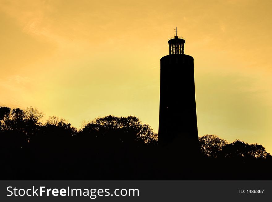 Lighthouse on deep orange sky