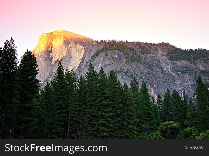 Half Dome is a granite dome at the eastern end of Yosemite Valley, possibly the Valley's most familiar sight. The granite crest rises more than 4,737 feet (1,440 m) above the Valley floor. Half Dome is a granite dome at the eastern end of Yosemite Valley, possibly the Valley's most familiar sight. The granite crest rises more than 4,737 feet (1,440 m) above the Valley floor