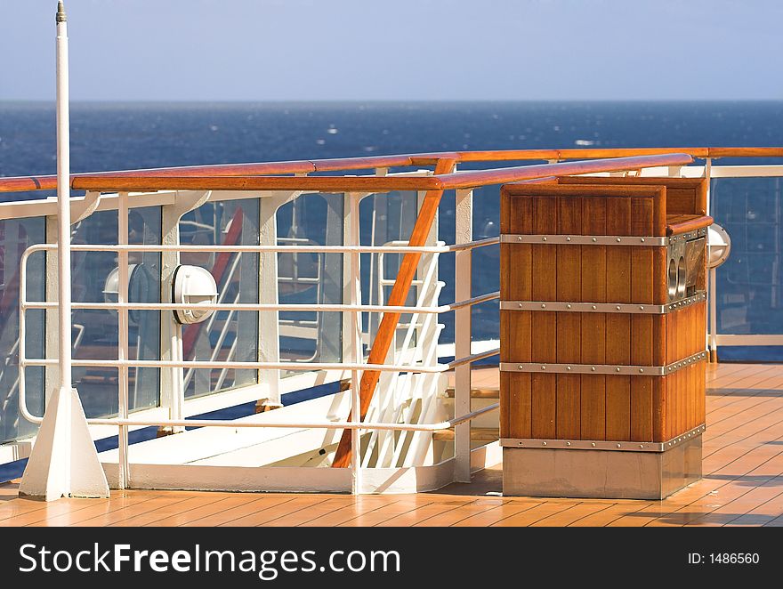 Deck of a luxury cruise liner with blue skies in background. Deck of a luxury cruise liner with blue skies in background