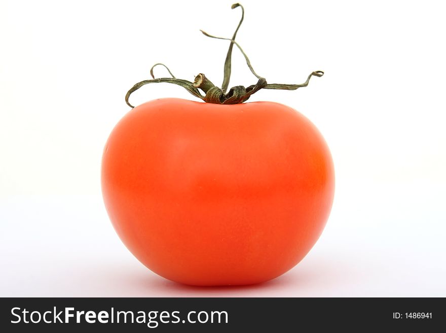 Healthy red cherry tomato with green stalk isolated on white. Healthy red cherry tomato with green stalk isolated on white