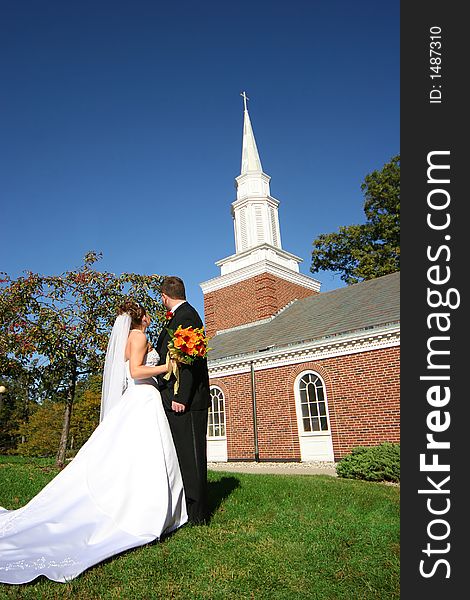 Bride and groom outside the chapel. Bride and groom outside the chapel