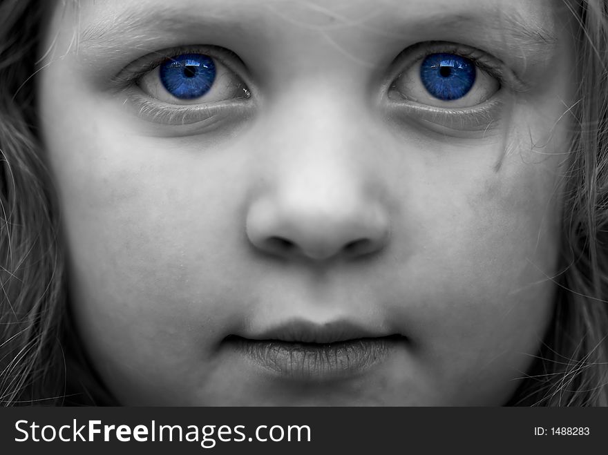 Black and white image of young girl: selective colorization; saturation. Haunting, moody image. Black and white image of young girl: selective colorization; saturation. Haunting, moody image.