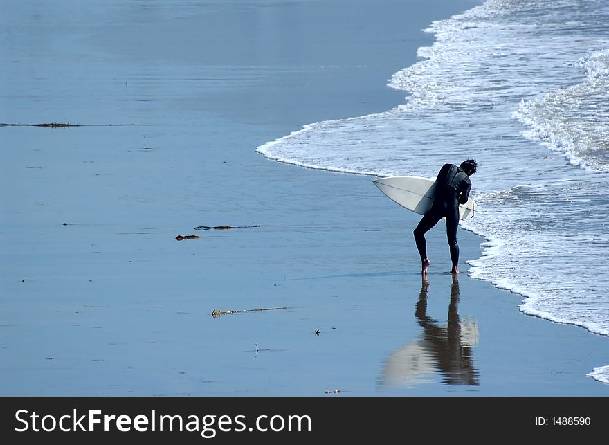 Man surfing at the beach in ca