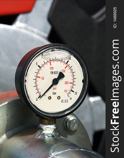Black pressure gauge on technical device