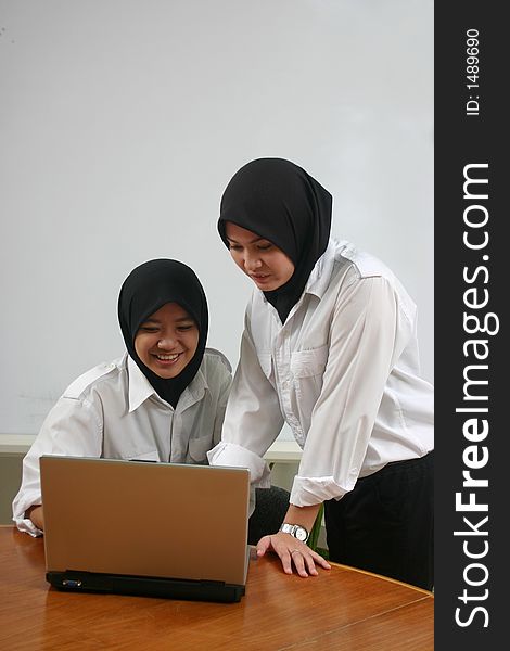 Asian girls using a laptop. Asian girls using a laptop.