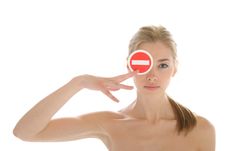 Beautiful Young Woman Holds Prohibiting Sign Stock Image