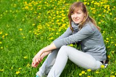 The Girl Sits On A Grass Royalty Free Stock Images The Girl Sits On A Grass Royalty Free Stock Images