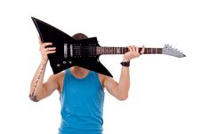 Player Holding His Guitar Over Face Stock Photos Player Holding His Guitar Over Face Stock Photos