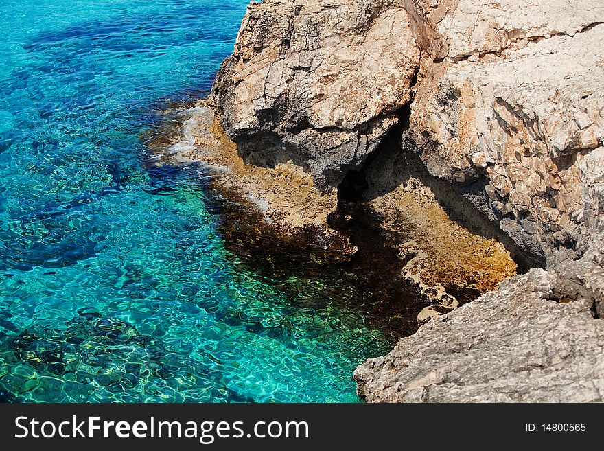 Turquoise water of the Mediterranean sea and coastal rocks