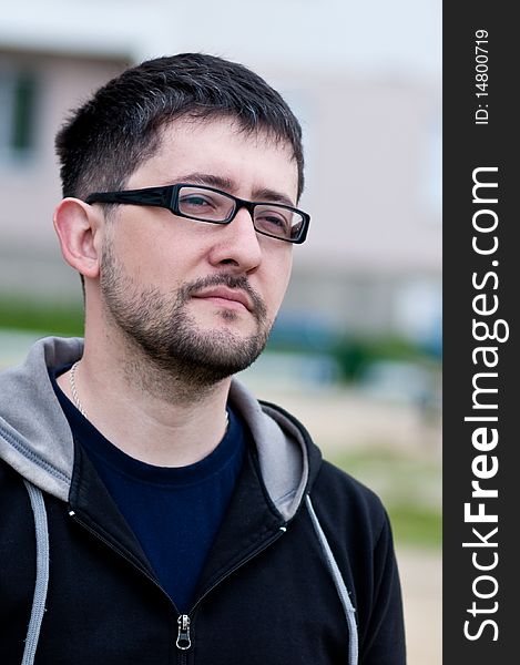 Portrait Of A Young Bearded Man Wearing Glasses