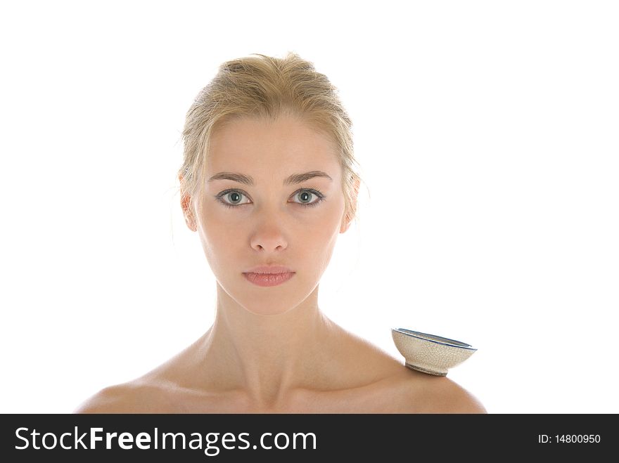 Young woman with cup on shoulder isolated in white