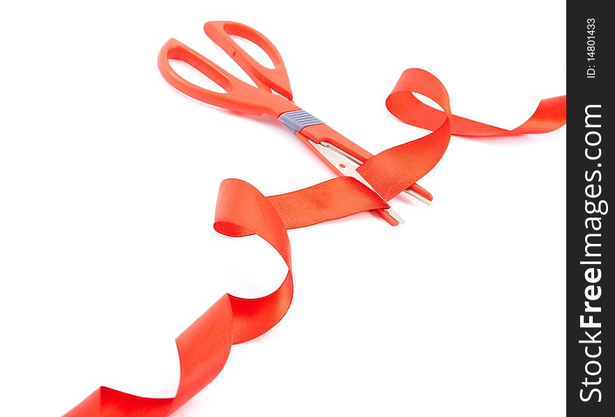 Scissors cutting red ribbon on white