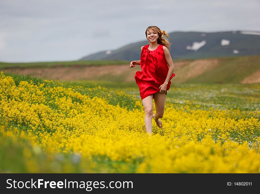 The girl in a blossoming field