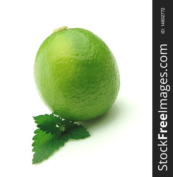 Lemon with mint branch on white background. Lemon with mint branch on white background