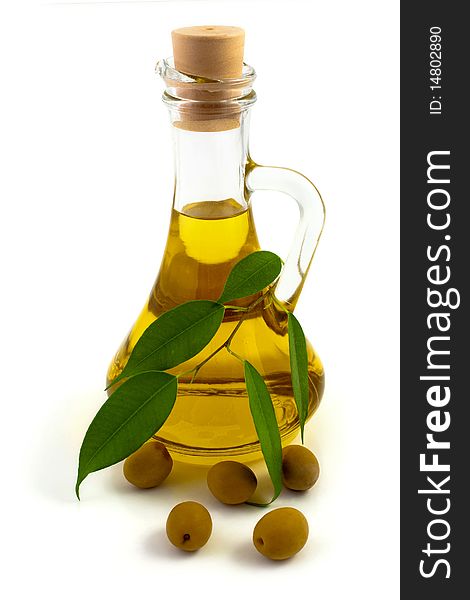 An image of a bottle of olive oil and olives. An image of a bottle of olive oil and olives