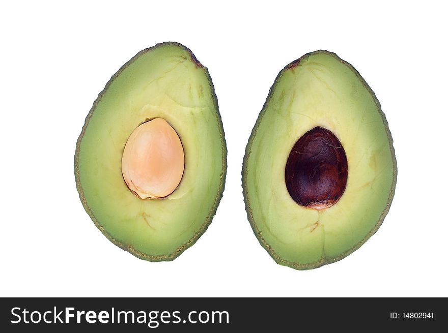 Avocado halved with seed over white isolated. Avocado halved with seed over white isolated