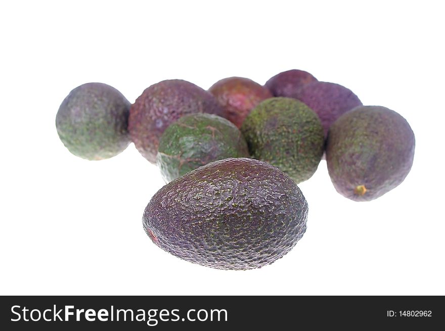 Whole avocado black skin variety over white isolated