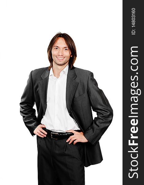 Young confident businessman standing in the corridor